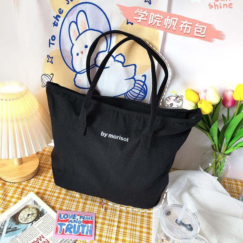 Blanco y negro simple carta bolsa de lona estilo coreano ins bolsa de lona hombro artístico versátil estudiante de gran capacidad bolsa de lona