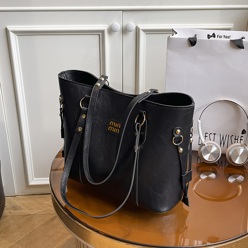 Texturas extranjeras bolsas de gran capacidad para mujeres otoño y invierno 2025, nuevas bolsas de hombro de moda, nicho, bolsas de viaje retro