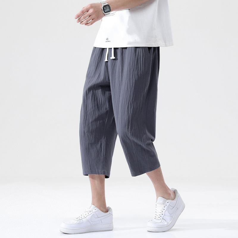Pantalones recortados pantalones casuales de los hombres de moda verano de los hombres delgados sueltos versión coreana de los hombres de algodón y lino de gran tamaño al por mayor