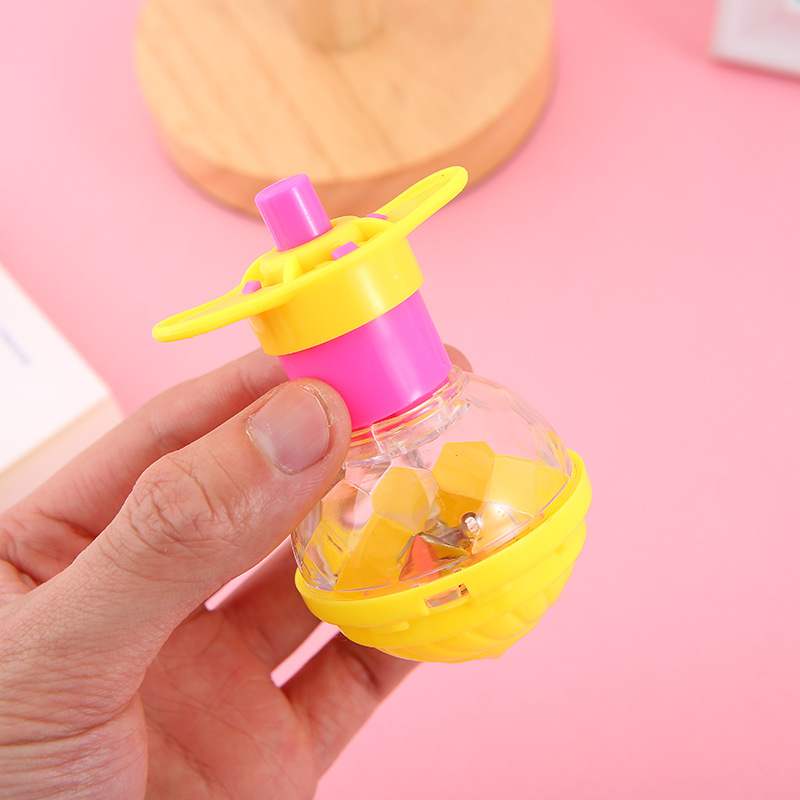 Nuevo transmisor luminoso Gyro pequeño regalo al por mayor kindergarten bebé pequeños juguetes de los niños