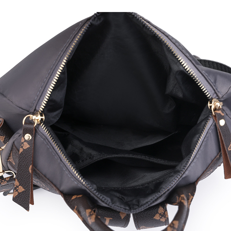 Comercio exterior al por mayor 2024 nueva moda europea y americana señoras mochila de nailon impresión color de contraste mochila de viaje de un solo hombro marea