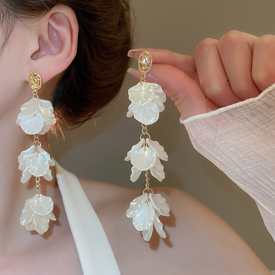 Pendientes de flor de lazo elegante de súper hada de plata Pendientes de moda de lujo ligero francés Pendientes de todo fósforo dulce de estilo literario