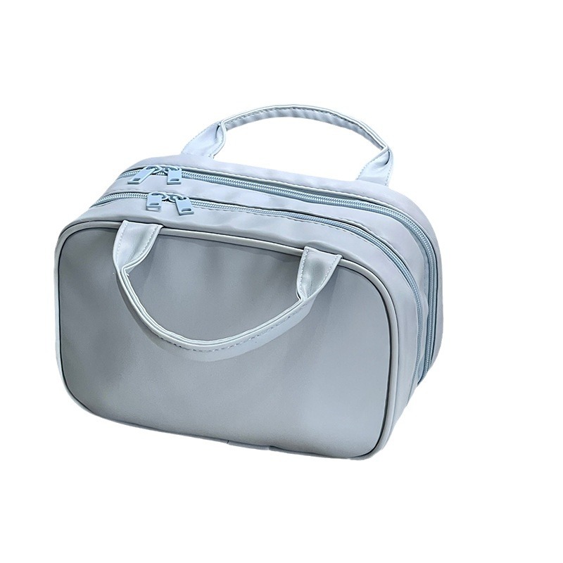 Nueva bolsa de maquillaje de lujo ligera de gran capacidad portátil PU bolsa de almacenamiento de dos cremalleras portátil bolsa de lavado de viaje impermeable