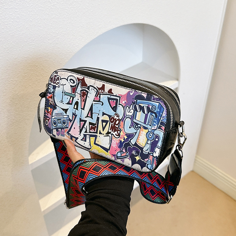 Bolso cuadrado pequeño estilo explosivo transfronterizo, graffiti de personalidad femenina, bolso puenting, bolso de cámara con correa de hombro ancha de moda, bolso de mensajero de hombro de todo fósforo