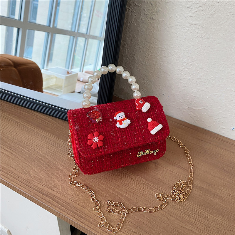 Mini moda para niñas bolso de cambio de perlas 2024 nuevo patrón de moda coreana bolso de ropa infantil