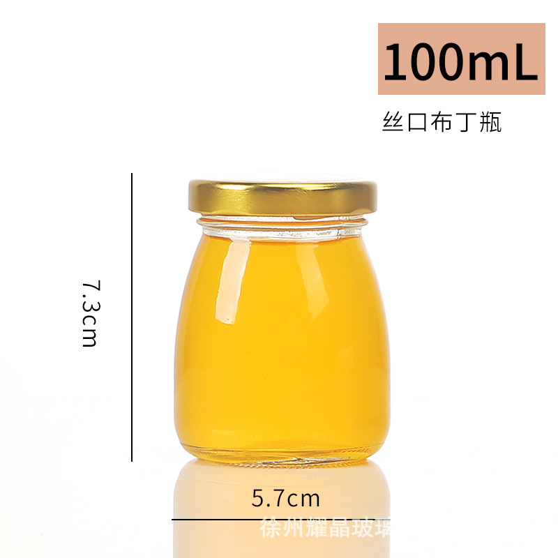 Botella de vidrio redonda de grado alimenticio, botella enlatada transparente sellada, botella de salsa de chile vacía, botella de miel con tapa para cocinar