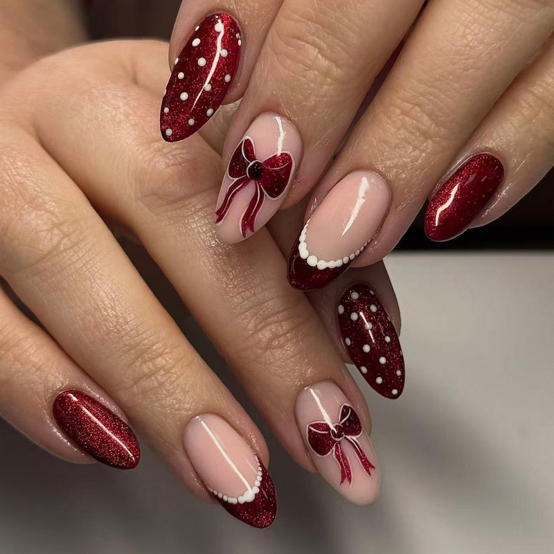 Vintage cat-eye wine-red bowknot Christmas nail art, white polka dot lace French-style oval press-on nails Vintage cat-eye wine-red bowknot Christmas nail art, white polka dot lace French-style oval press-on nails