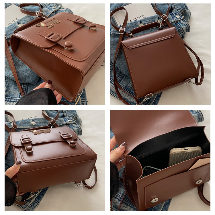 This is a new retro commuting backpack for the autumn of 2024, featuring a casual color contrast and a niche design. It is a small square single-shoulder hand-carry bag undefined