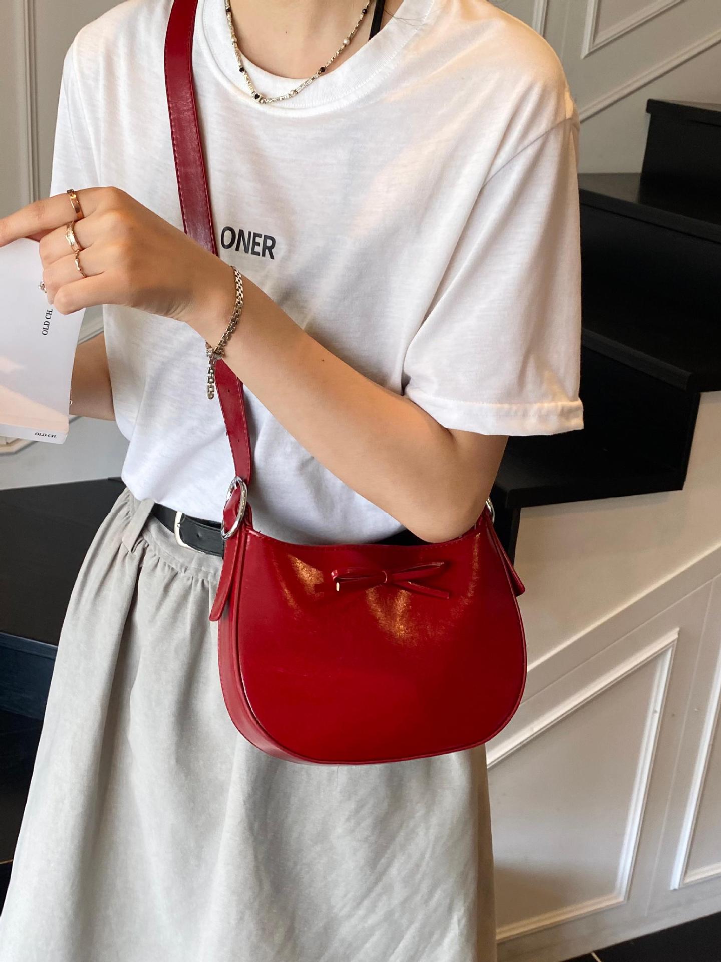 Nicho coreano de lujo ligero arco brazo bolso para mujeres 2025 nuevo estilo versátil bolso de hombro de estilo extranjero bolso de moda