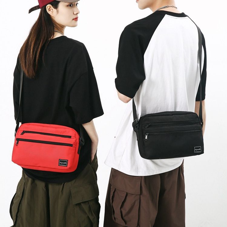 Bolso de hombro de los hombres japoneses ins estilo bolso de mensajero casual personalizado de moda estilo coreano bolso de mensajero estudiante pequeño bolso de hombro femenino