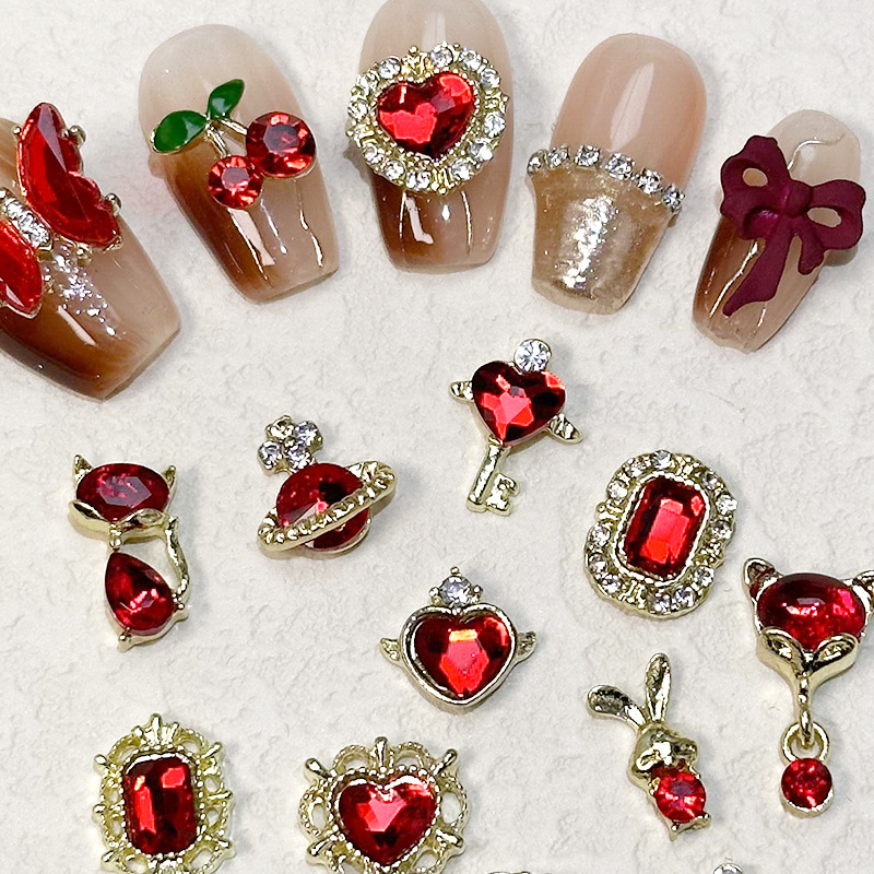 2023 Nueva joyería de uñas Año nuevo rojo aleación conejo rojo mariposa de cristal pintura en aerosol arco accesorios de diamantes de uñas