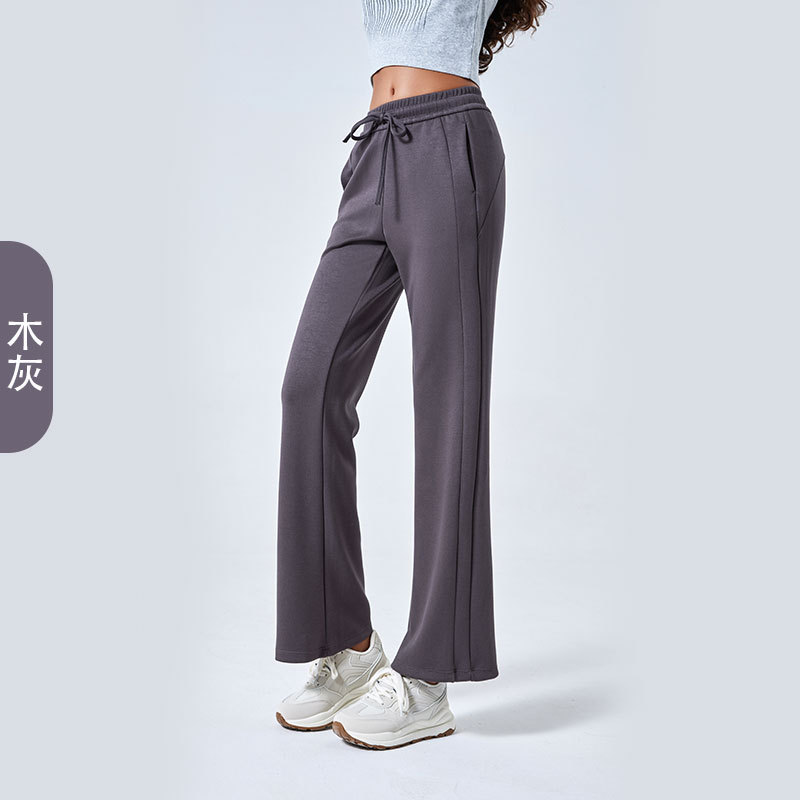 Otoño y invierno nuevo aire de algodón suelto pantalones deportivos simples de mujer cuerda delgada pantalones de yoga de doble bolsillo