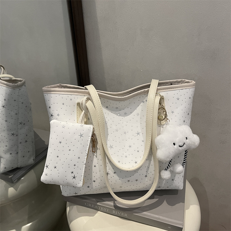 2026 primavera nueva bolsa de hombro de gran capacidad bolsa de brazo universal tendencia transfronteriza dulce viento bolso de mano bolso de mujer