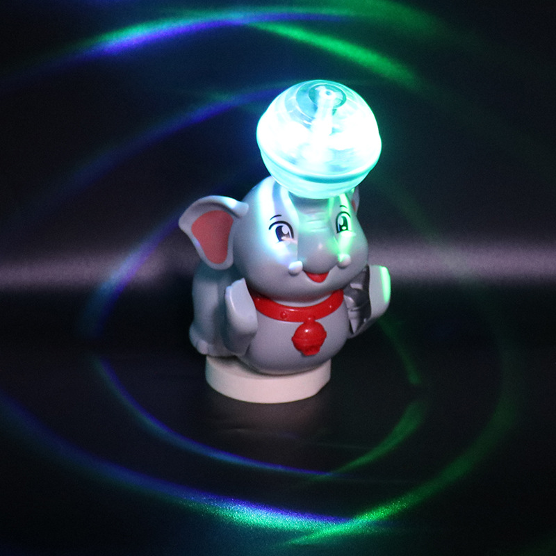 Tiktok mismo eléctrico Stunt cúpula elefante música luz giratoria sueño bola de luz juguete para niños al por mayor