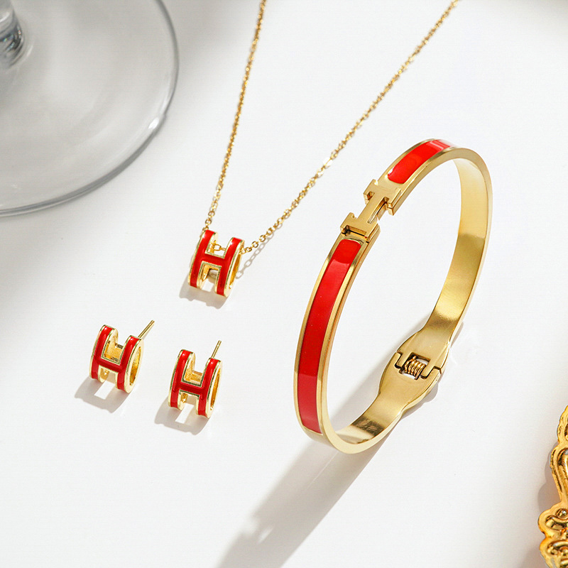 Gold and red necklace earrings bracelet
