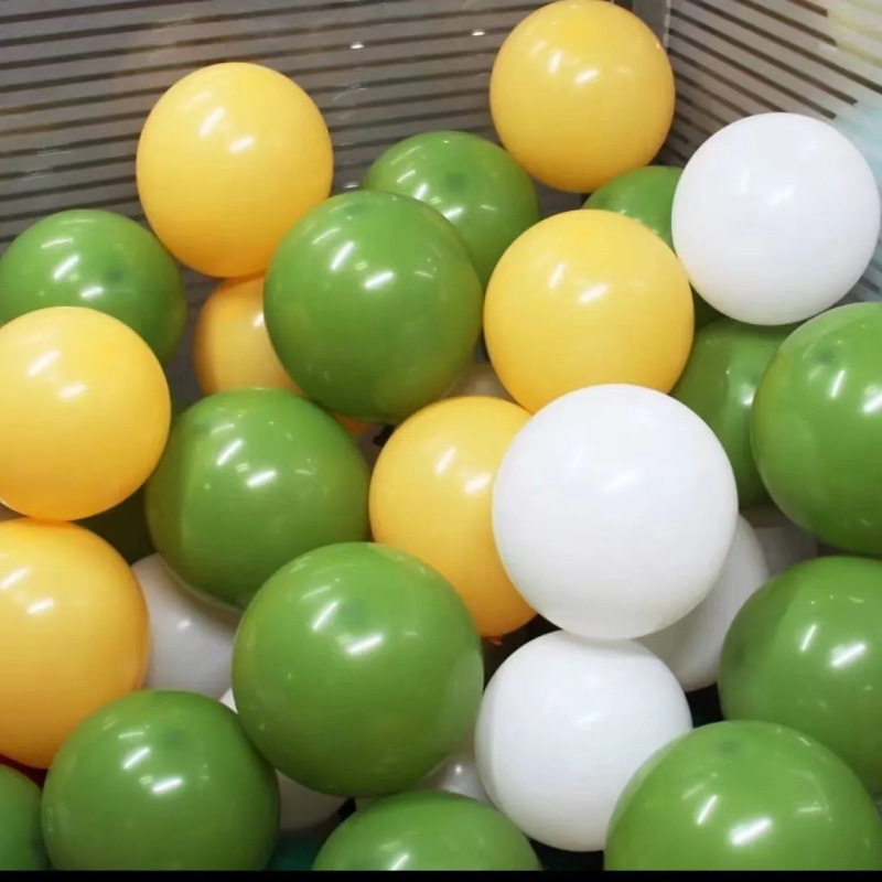 Green olive balloons for children's birthday decorations, kindergarten setup, forest theme balloon arrangement, woodland style.