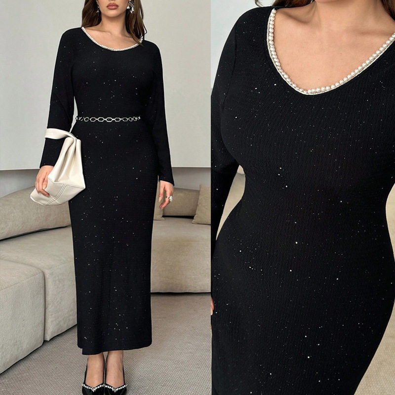 Plus-size women's black glitter fabric dress with pearl round neck, long sleeves, chain belt, and slim-fit bodycon design Plus-size women's black glitter fabric dress with pearl round neck, long sleeves, chain belt, and slim-fit bodycon design