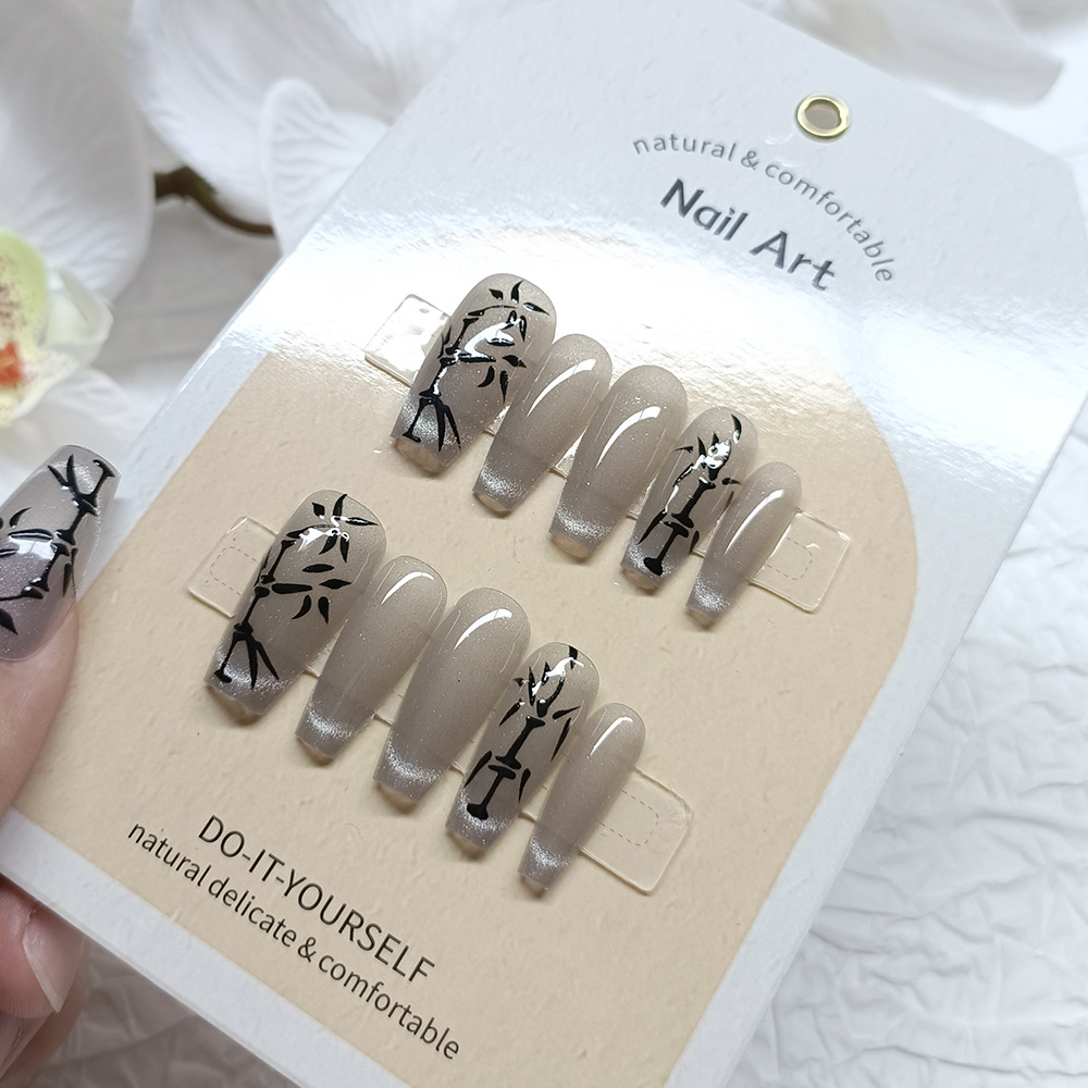Ventas transfronterizas en caliente manuales de manicuras, decoración de bambú transparente, desgaste de uñas 10 piezas, parches de uñas de ojo de gato.