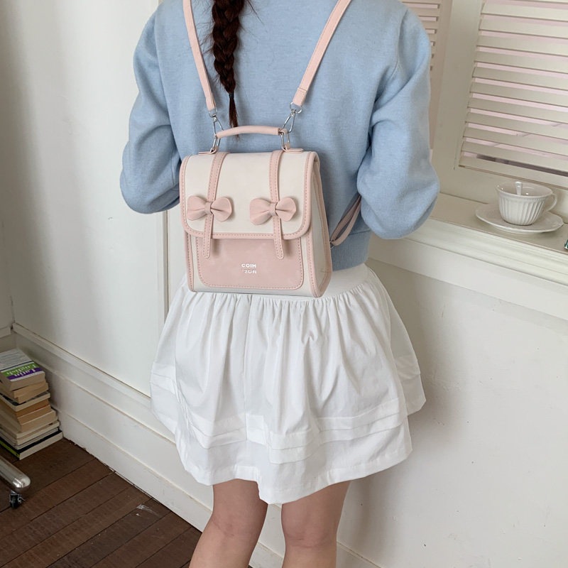 Mochila de temperamento de viaje femenino 2026 de alto valor de cara simple coreana mochila de viaje nuevo arco bolso pequeño