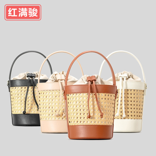 New handmade woven rattan bucket bag for women: chic hollowed-out drawstring tote perfect for beach vacations, also a unique choice as a shoulder or crossbody bag.