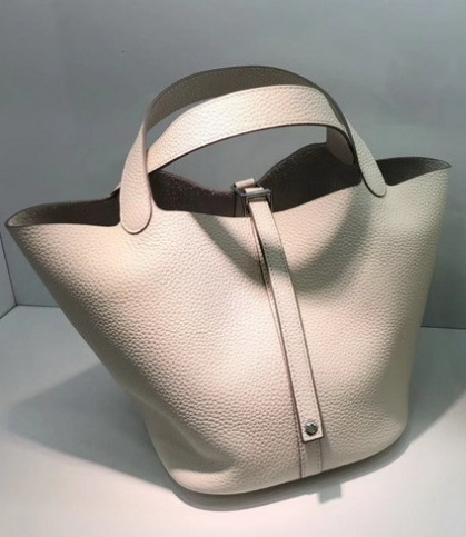 El nuevo bolso de cesta de verduras de marea de cuero togo de piel de vaca de capa superior 2025, bolso de cubo con cerradura de mano, bolso de cuero para mujer