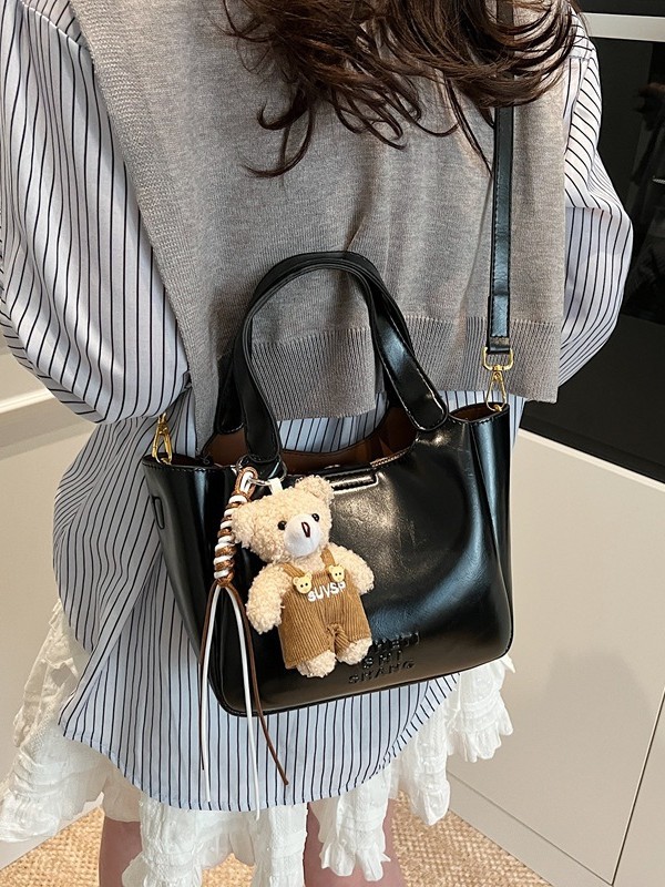Vintage Maillard bolso de mano para mujeres 2025 nuevo estilo transfronterizo popular aceite cera cuero bolso de cubo textura mochila