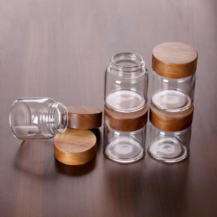 Factory Wholesale 55mm High Borosilicate Glass Bottle 90/120ml Acacia Wooden Lid Thread Sealed Wooden Lid Storage Jar