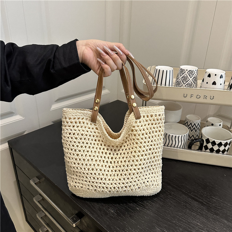 Bolsas de paja transfronterizas bolsas de mujer 2025 nueva moda simple gran capacidad bolsa de hombro hueco bolsa de playa bolsa de bolsa