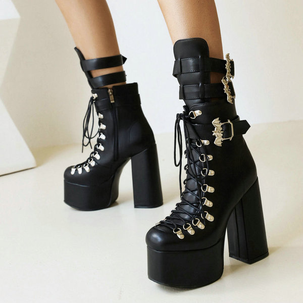 Black high boots with extremely high heels platform made of patent…