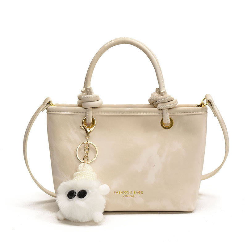 Bolso de mano casual simple coreano para damas 2025 nuevo estilo de transporte universal bolso de cubo popular mochila de hombro