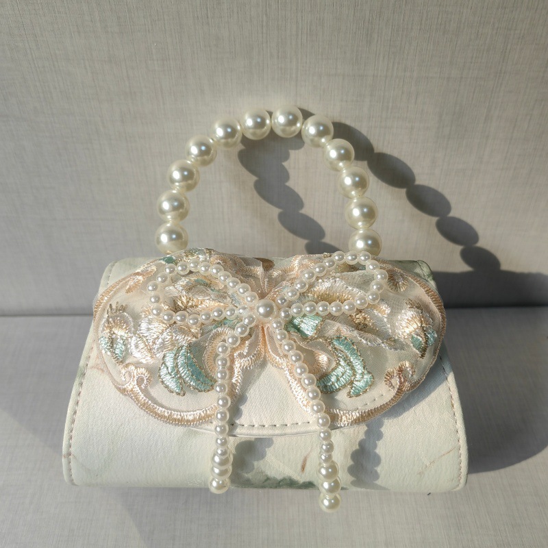 2025 primavera y verano estilo caliente moda casual niños dulces bolsa de gelatina mini bolso de mensajero de un solo hombro variedad al por mayor