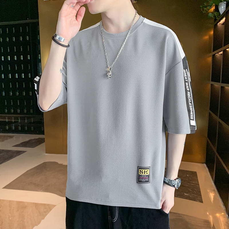 Camiseta de manga corta para hombres de verano de cinco puntos de manga de Hong Kong estilo de deporte transpirable media manga juvenil camiseta suelta universal