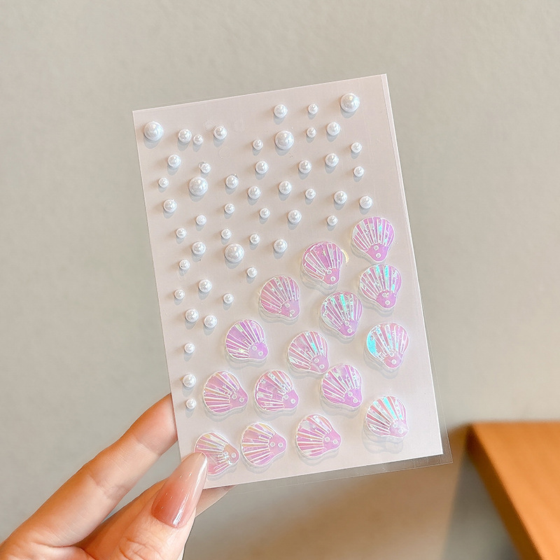 Pequeña niña rendimiento de rendimiento pegatinas coloridas conchas sin pegamento pegatinas faciales aurora perlas decoración facial pegatinas Yiwu al por mayor