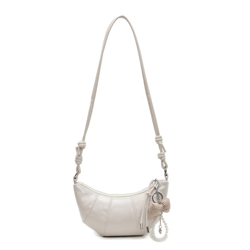 Bolso de todo fósforo de diseño de nicho para mujer 2025 nuevo bolso de cuerno de costura de color sólido bolso de axila de sentido avanzado de viaje casual