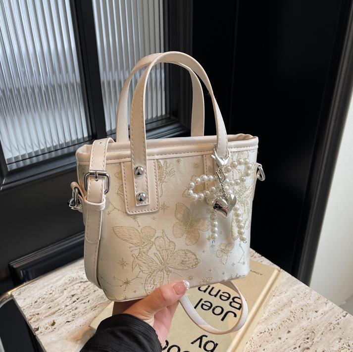 Bolsa de cubo de mano para mujeres 2025 nuevo estilo nacional popular bolso de hombro alta textura versátil bolso de moda moda