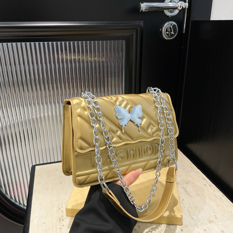 Casual simple color sólido moda 2025 nueva cadena de moda diamante hombro de mano bolso pequeño para mujeres