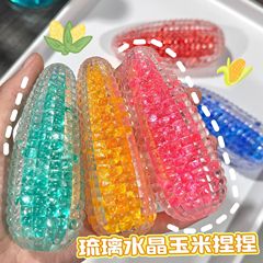 瑠璃水晶のトウモロコシのつまみの音楽はボールのトウモロコシの可塑性のスプリングバックのつまみの音楽の減圧のおもちゃをつぶして砂を流します。