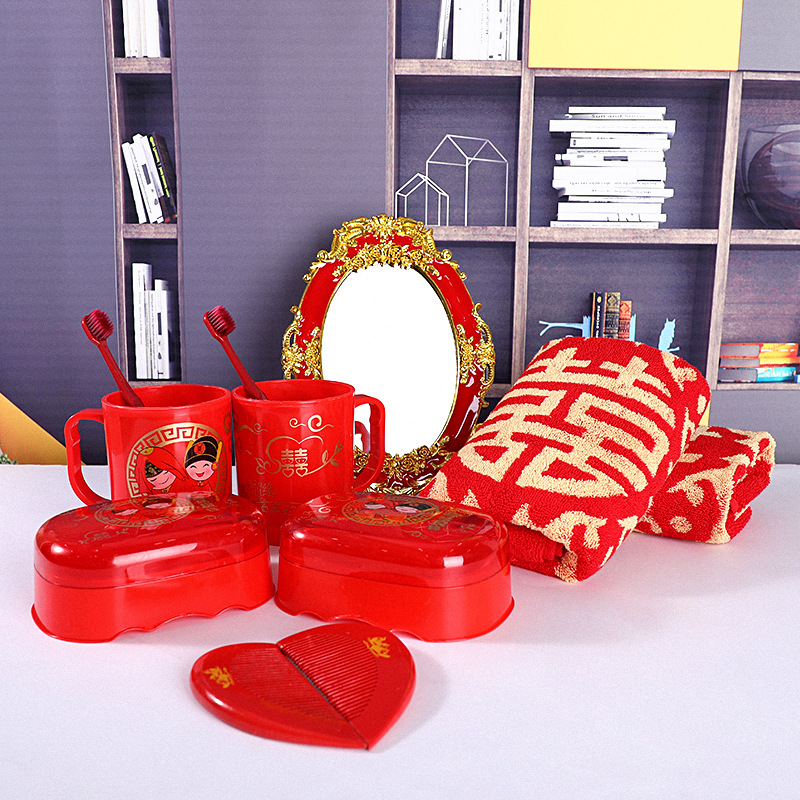 Wedding toiletry set for brides, including matching red mouthwash cups, toothbrushes, and soap dishes for couples.