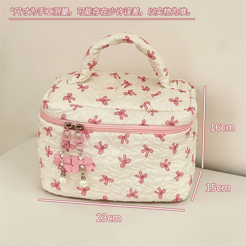 Nueva bolsa de almacenamiento de dormitorio de estudiantes de nicho de arco de maquillaje portátil de gran capacidad para salir a lavar