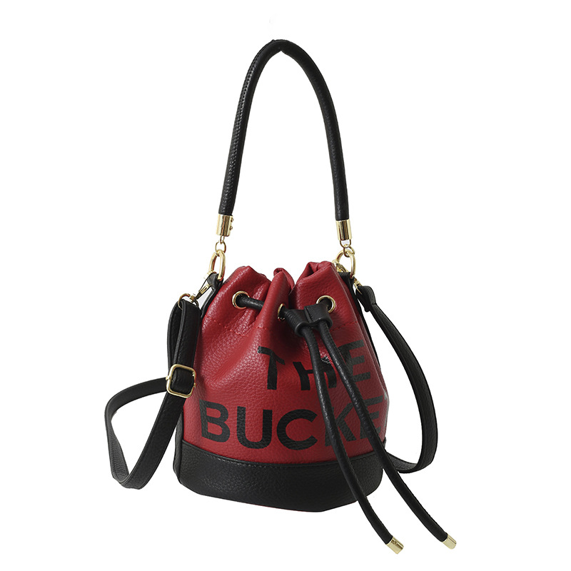 Bolso de hombro femenino casual todo-fósforo diseño de nicho sentido contraste color costuras cubo bolso de mano moda tendencia bandolera
