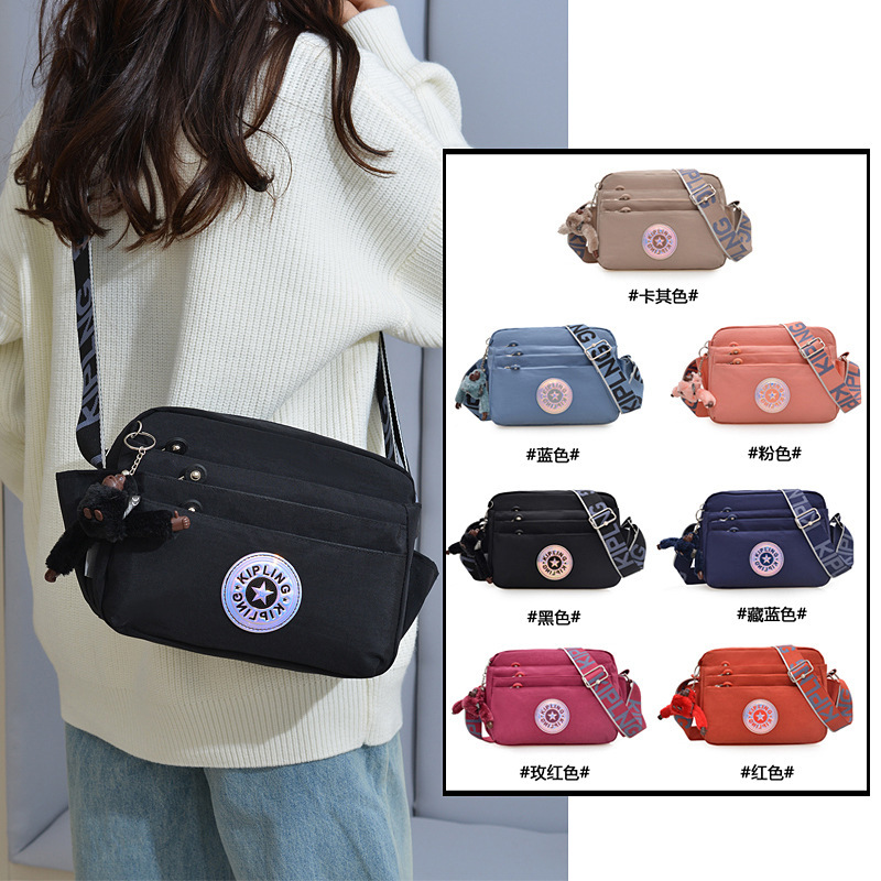 New KP Women's Shoulder Bag Water-repellent Nylon Cloth Crossbody Bag Ultra Light New Standard Monkey Pendant Women's Shopping Crossbody Bag