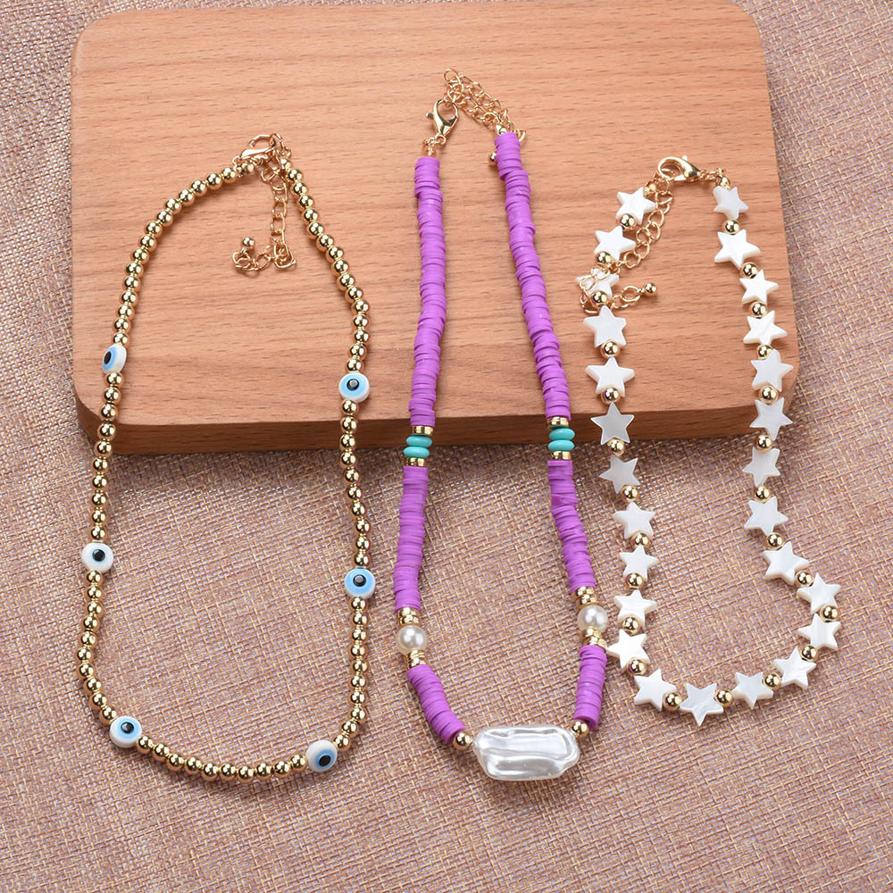 Casual Ethnic Style Star Eye Alloy Soft Clay Beaded Pearl Plating Women's Necklace display picture 5