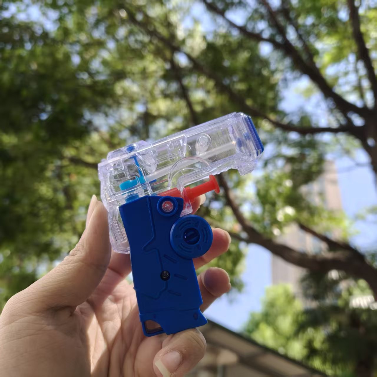 Mini jardín de infantes pistolas de agua para niños verano transparente jugando en la playa de agua juguetes de agua tienda de regalos de venta caliente