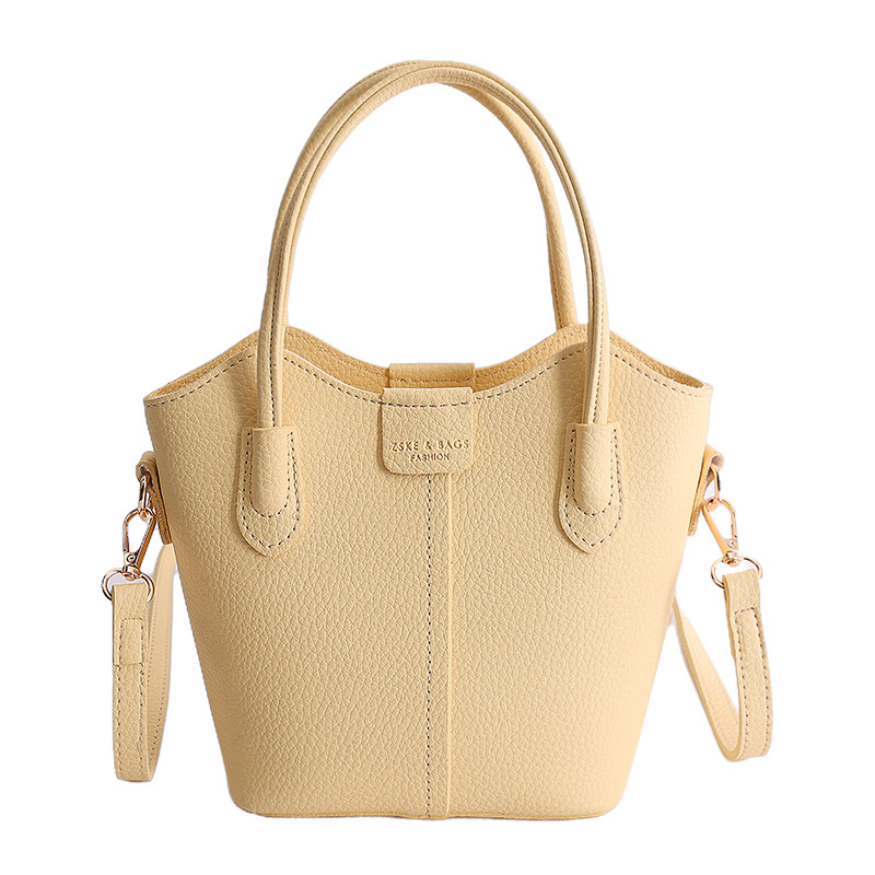 Bolso de mano de moda retro 2026 nuevo temperamento simple bolso de cubo de viaje ocio mochila de hombro