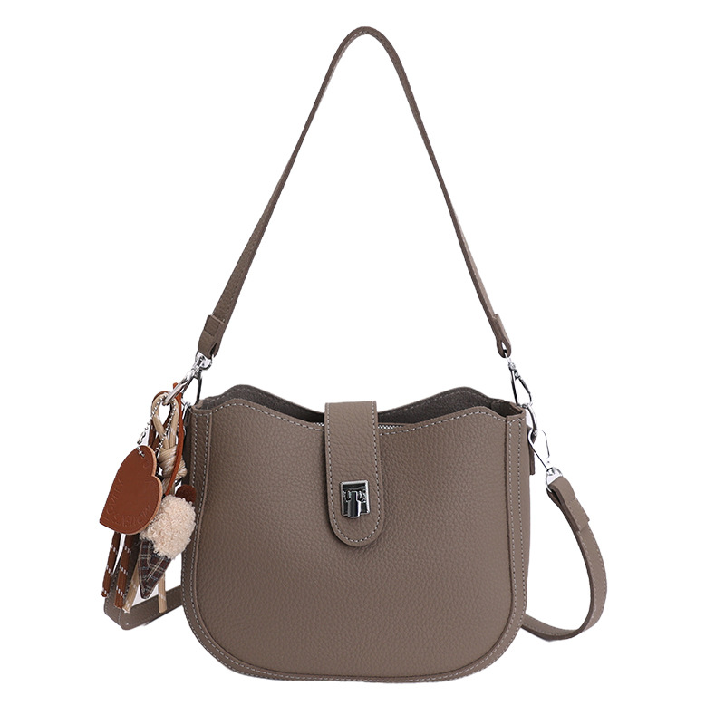 Hot sale nuevo nicho coreano litchi estampado bolso de cubo de hombro para mujeres sensación de lujo ligero versátil bolso de transporte de viaje