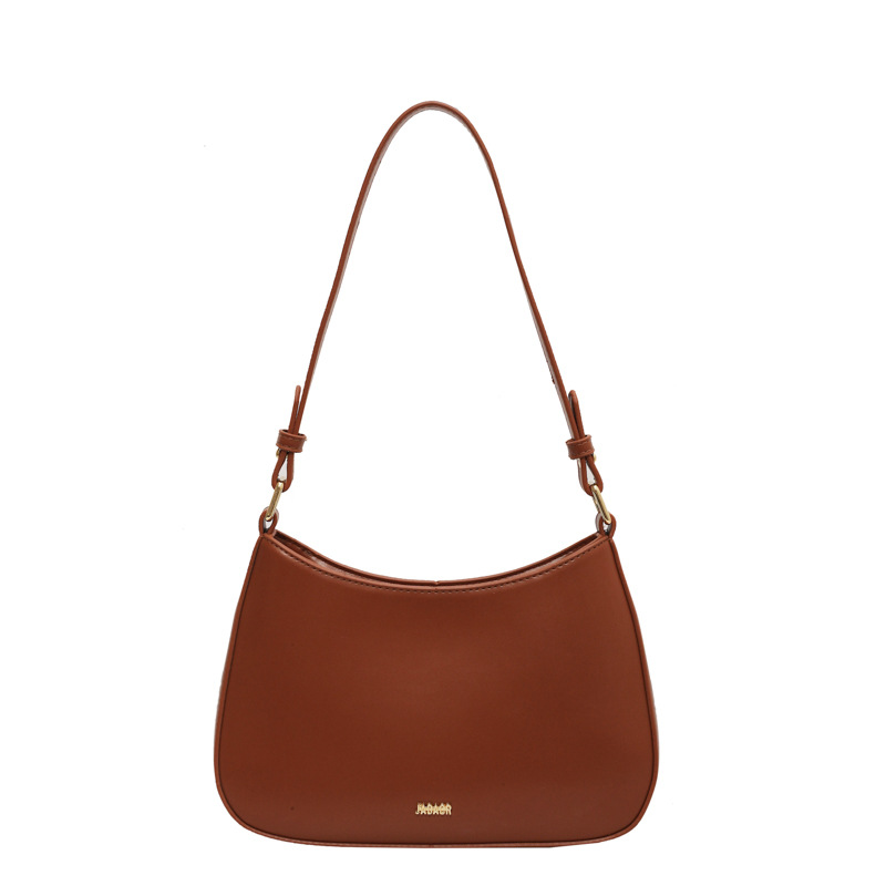 Bolso de moda de mujer 2024 verano nuevo estilo de moda bolso de brazo francés de textura simple bolso de palo nicho bolso de mochila
