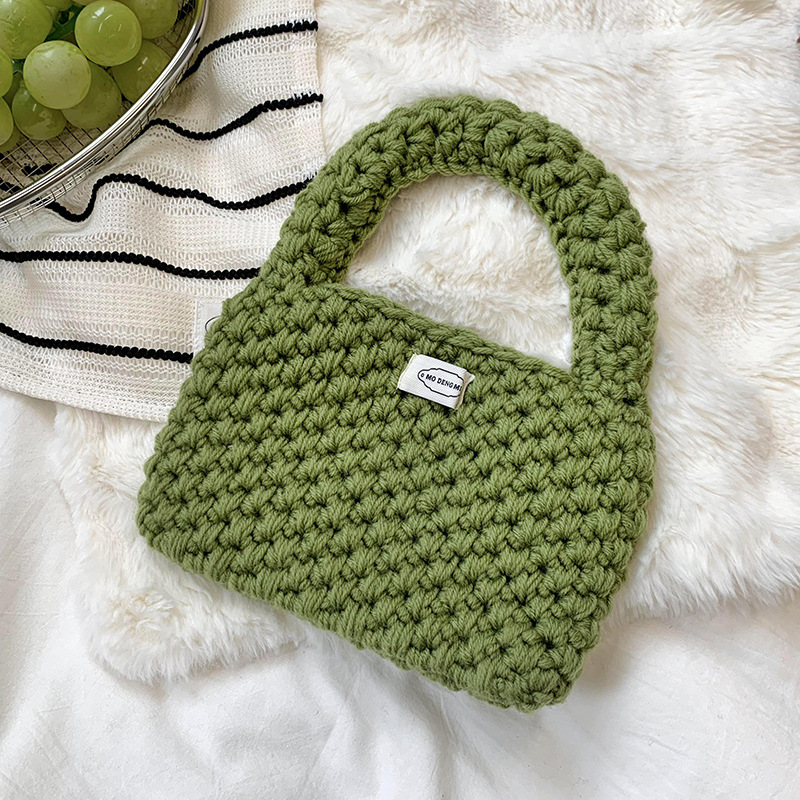 Bolsa de mano de damas de otoño y invierno 2025 nuevo estilo simple ganchillo a mano lana tejido bolsas de hombro al por mayor