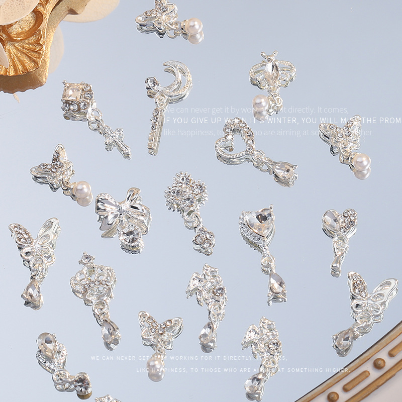 Nueva joyería de aleación de manicura completa diamante borla arco corona plata uñas manicura joyería accesorios al por mayor