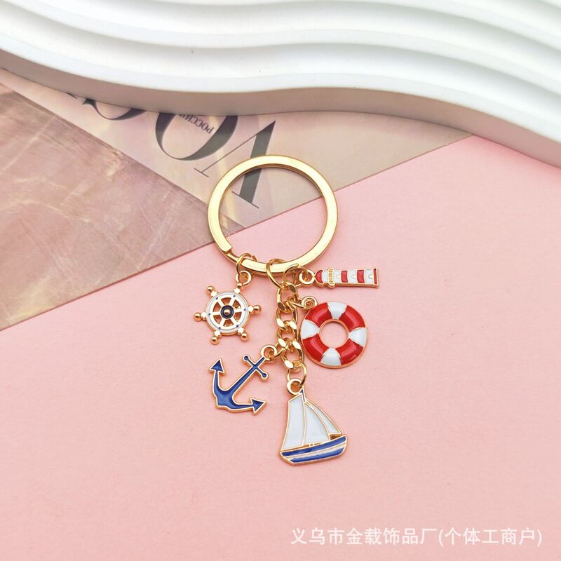 国境を越えた航海帆船のキーホルダーに油を垂らした金属灯台救命輪船舵文創プレゼントバッグストラップ飾り|undefined