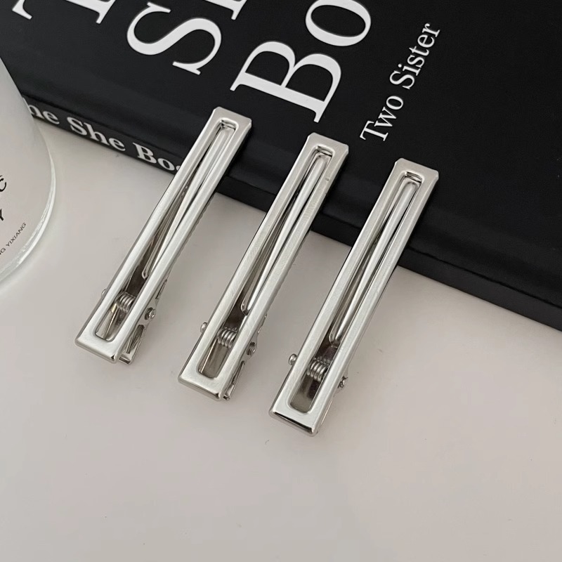 Fijación de cabello de metal fría plata en forma de clip de nariz de pato temperamento agujero estrellas clip de cabello frente lateral clip de cabello roto mujer